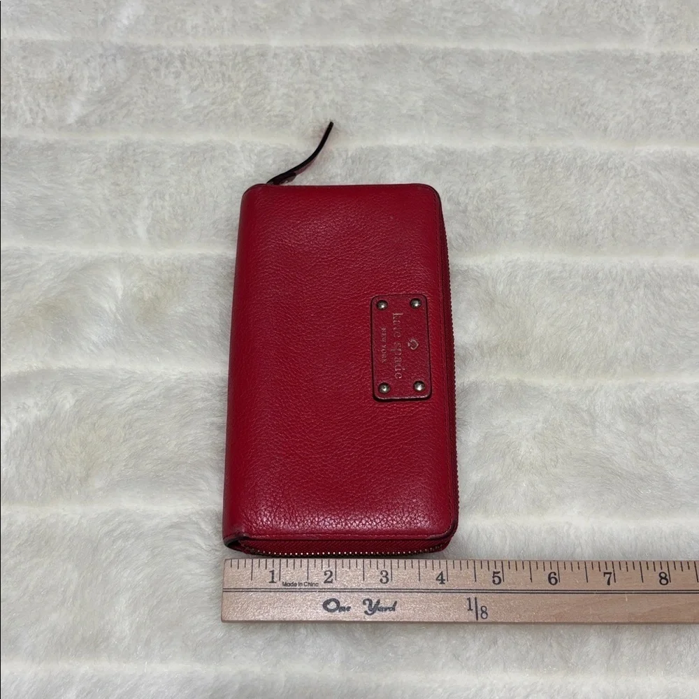 Kate Spade Red Pebbled Leather Zip Around Wallet with Logo Plate